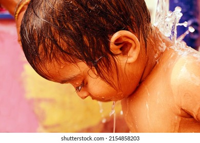 An South Asian Child Taking Bath