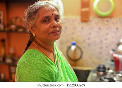 South Asian Or Indian Housewife Cooking In The Kitchen