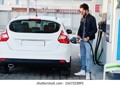 South Asian Man Or Indian Male Refueling His White Car On Gas Station.