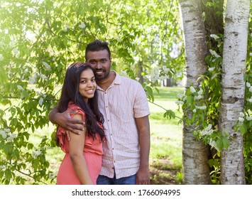 A South Asian  Young Couple Is Walking In City Park