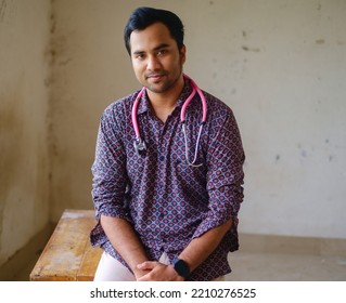 South Asian Young Male Doctor Holding A Stethoscope Wearing Shirt 