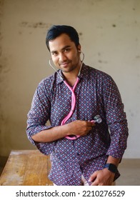 South Asian Young Male Doctor Holding A Stethoscope Wearing Shirt 