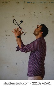 South Asian Young Male Doctor Holding A Stethoscope Wearing Shirt 