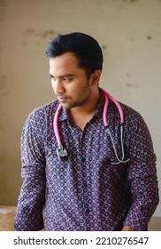 South Asian Young Male Doctor Holding A Stethoscope Wearing Shirt 