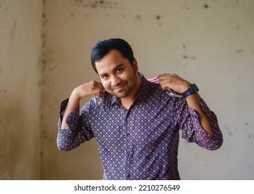 South Asian Young Male Doctor Holding A Stethoscope Wearing Shirt 