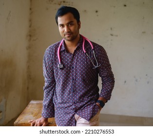 South Asian Young Male Doctor Holding A Stethoscope Wearing Shirt 