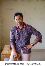 South Asian Young Male Doctor Holding A Stethoscope Wearing Shirt 