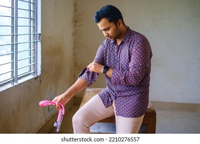 South Asian Young Male Doctor Holding A Stethoscope Wearing Shirt 