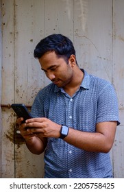 South Asian Young Muslim Boy Busy With Smartphone, Handsome Man Fashion Concept With Mobile Phone 