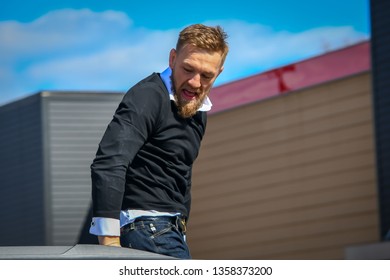 South Boston, MA - 3/17/19: Conor McGregor emerging from his car at the St Patrick's Day parade