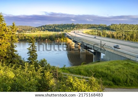 South bound view to the Quesnell Bridge   that spans the North Saskatchewan River in Edmonton, Alberta, Canada at low sun evening light