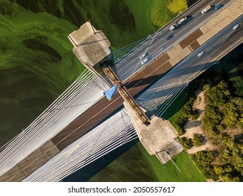 South Bridge In Kiev. Algae Bloom In The Water Of The Dnieper River. Aerial Drone View.