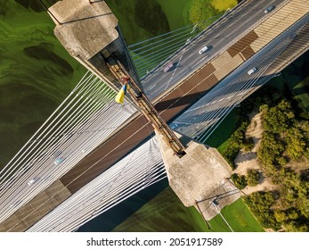 South Bridge In Kiev. Algae Bloom In The Water Of The Dnieper River. Aerial Drone View.