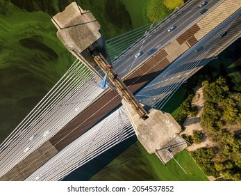 South Bridge In Kiev. Algae Bloom In The Water Of The Dnieper River. Aerial Drone View.