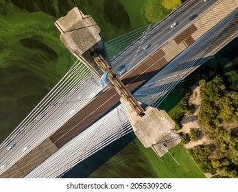 South Bridge In Kiev. Algae Bloom In The Water Of The Dnieper River. Aerial Drone View.