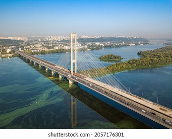 South Bridge In Kiev. Algae Bloom In The Water Of The Dnieper River. Aerial Drone View.