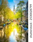 South Church Zuiderkerk and Houses over canal with mirror reflections, Amsterdam, Netherlands