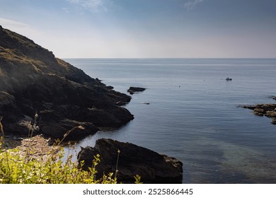 South cornwall coast cliffs and English channel, Blue sky and deep blue sea. Rocky coastline.  - Powered by Shutterstock