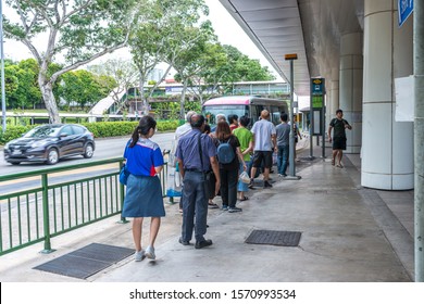 South East Asia / Singapore - Nov 22, 2019 : Asian People Queuing Up For Public Transport Bus