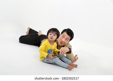 South East Asian Father Son Child Playing Talking With Tablet Pc Tab On White Background Show Point
