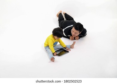 South East Asian Father Son Child Playing Talking With Tablet Pc Tab On White Background