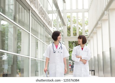 South East Asian Female Doctors Walking