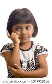 South East Asian Six Year Old Baby Girl With Thinking Pose 