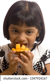 South East Asian Six Year Old Baby Girl Eating Mango 