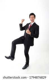 South East Asian Young Chinese Man Wearing Formal Business Office Ware On White Background Dance Walk Joy Happy Fist