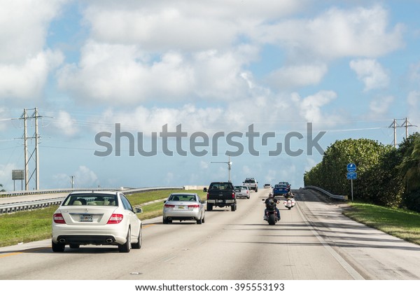 SOUTH FLORIDA, USA - DEC\
14, 2015: Traffic with cars and motorbikes on highway in South\
Florida, USA