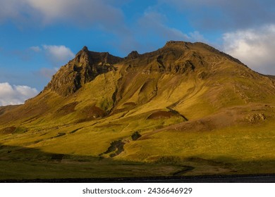 South Iceland mountain landscape in Vík í Mýrdal villages area with volcanic mountain ridge covered with moss, sunset view. - Powered by Shutterstock