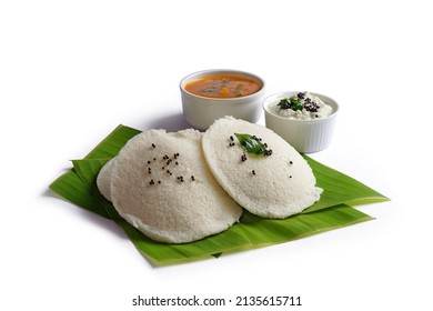 South indian breakfast food idli with sambar and chutney on banana leaf. Isolated image with selective focus and shalow depth of field.          
