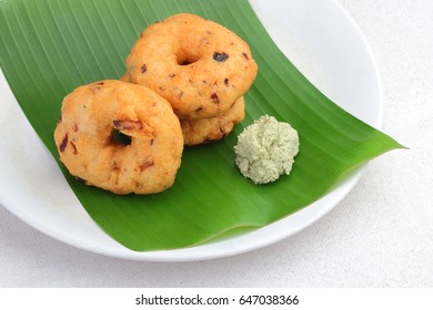 South Indian food 'Vadai' with coconut chutney on banana leaf