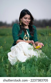 south indian girl green blouse and white skirt rice field - Shutterstock ID 2237383705