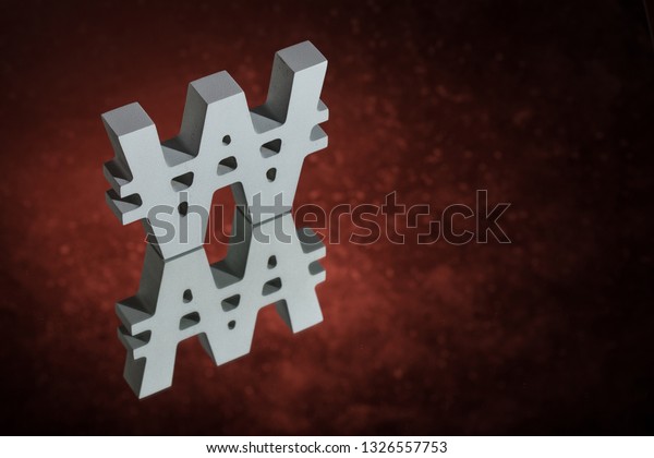 South Korean Currency Symbol or Sign Won
With Mirror Reflection on Red Dusty
Background