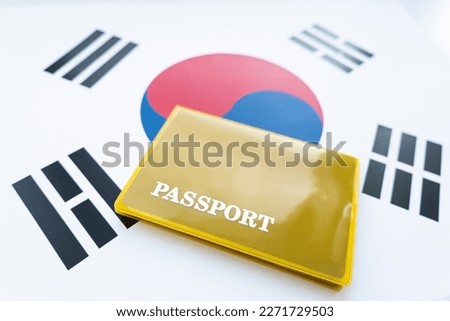 South Korean passport,Republic of Korea passport on the top of an satin korean flag