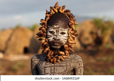 SOUTH OMO - ETHIOPIA - JANUARY 4, 2017: Unidentified Mursi tribal boy in the Mago National Park, Lower Omo Valley