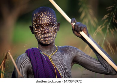 SOUTH OMO - ETHIOPIA - OCTOBER 10, 2017: Unidentified young Suri boy at a ceremony in Lower Omo Valley