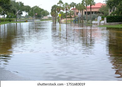 South Pasadena, Florida  USA - June 7 2020: Cars Navigate Flooded Streets In The Tampa Bay Region From Tropical Storm Cristobal.