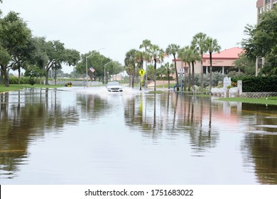 South Pasadena, Florida  USA - June 7 2020: Cars Navigate Flooded Streets In The Tampa Bay Region From Tropical Storm Cristobal.