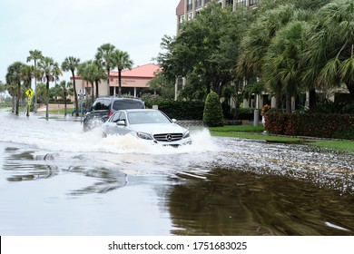 South Pasadena, Florida  USA - June 7 2020: Cars Navigate Flooded Streets In The Tampa Bay Region From Tropical Storm Cristobal.