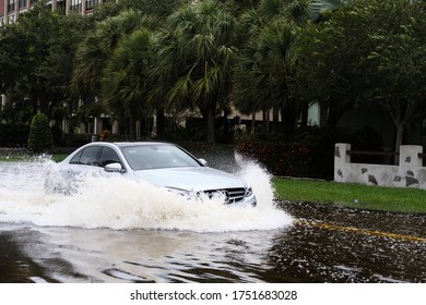 South Pasadena, Florida / USA - June 7 2020: Cars Navigate Flooded Streets In The Tampa Bay Region From Tropical Storm Cristobal.