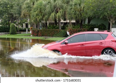 South Pasadena, Florida / USA - June 7 2020: Cars Navigate Flooded Streets In The Tampa Bay Region From Tropical Storm Cristobal.