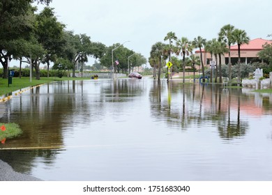 South Pasadena, Florida  USA - June 7 2020: Cars Navigate Flooded Streets In The Tampa Bay Region From Tropical Storm Cristobal.