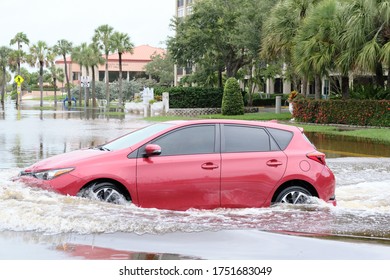 South Pasadena, Florida / USA - June 7 2020: Cars Navigate Flooded Streets In The Tampa Bay Region From Tropical Storm Cristobal.