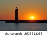 South Pierhead Light (1903) at sunset, Muskegon, Lake Michigan, USA