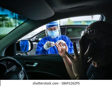 South Tangerang, Indonesia - November 30, 2020: Drive Thru Covid-19 Rapid Test Service By Nurse At Hospital Parking Area