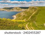South West Coast Path with a view over the Jurassic Coast and the climb up on Emmett