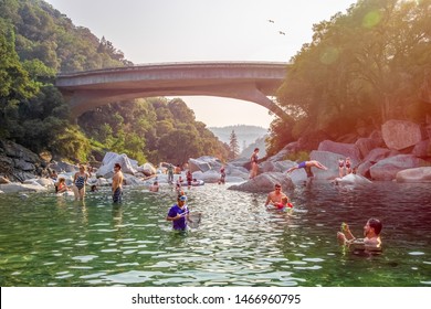 South Yuba River, Nevada City, California- July 28, 2018: Vacationers frolicking in the river