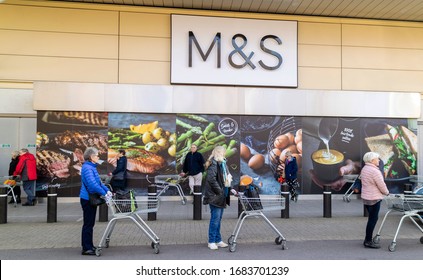 Southampton, England, UK. March 2020.  Elderly People Standing In Line And Six Feet Apart Wait To Enter A Supermarket For The 'silver Hour' Shopping Experience. During The Coronavirus Scare. UK